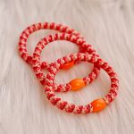 Haarrekker / armbandje koraalrood