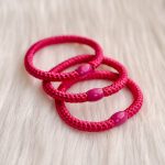 Haarrekker / armbandje donker fuchsia