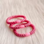 Haarrekker / armbandje roze blinkers